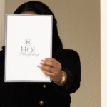 House of Intelligence team member holding a branded HOI Marketing folder